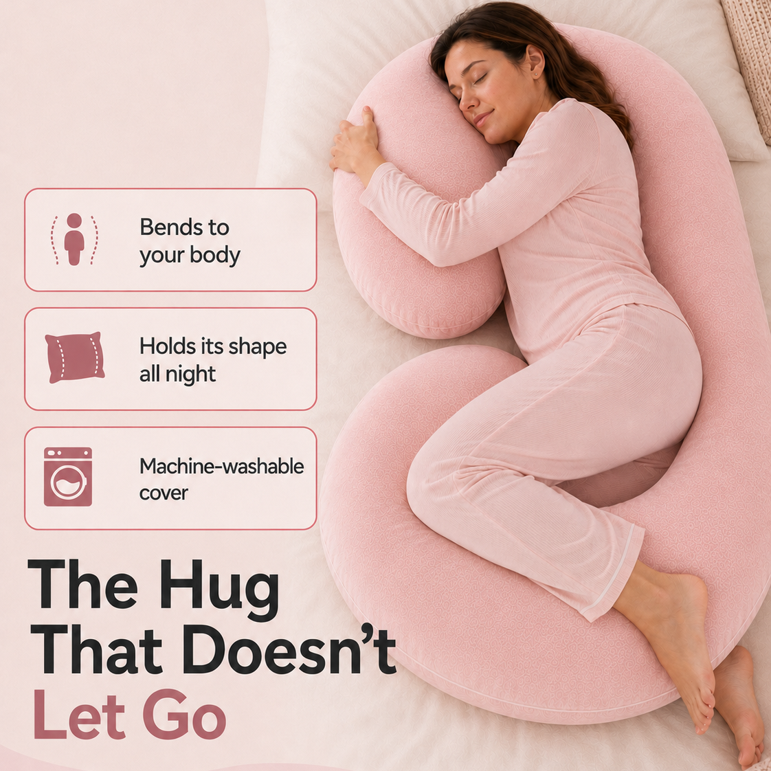 A woman in a pink pajama set reclines on a large pink U-shaped body pillow on a bed, with text callouts highlighting features like bending to the body, holding shape all night, and machine-washable cover.
